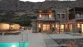Zum Verkauf auf Kreta: Traumhafte Luxus-Villa mit sieben Zimmern direkt am Meer. atemberaubender Meer- und Insel-Blick. Plaka, Elounda